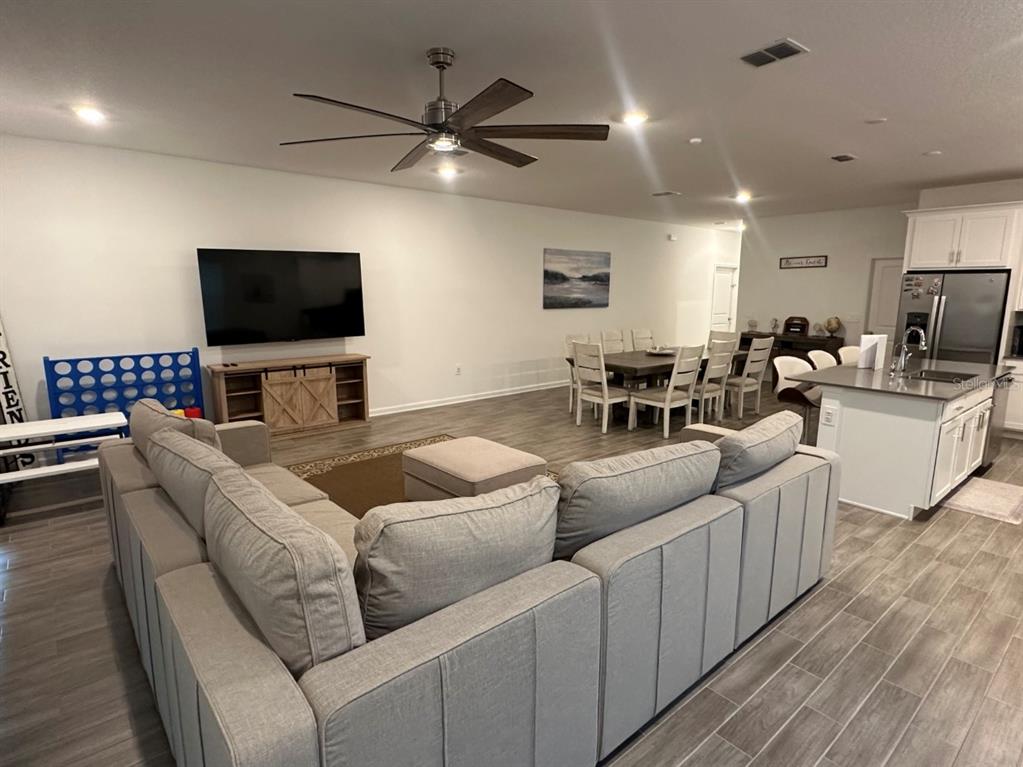 2759 Slash Way St. Cloud, FL 34771 - Photo 8 of 45 a living room with furniture and a flat screen tv