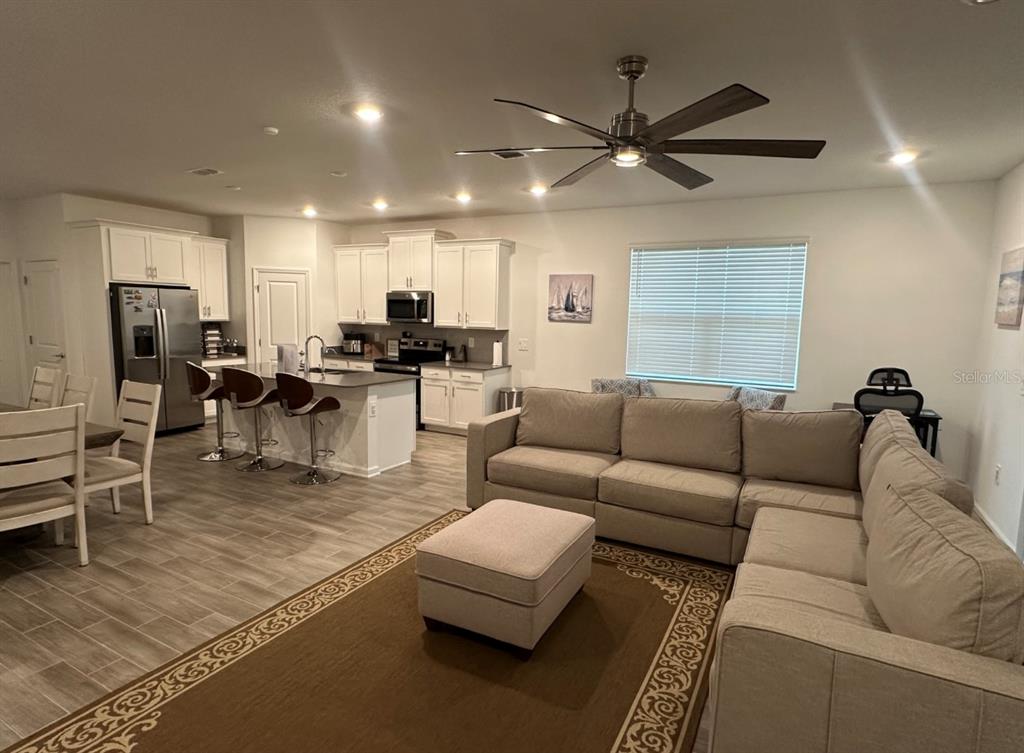 2759 Slash Way St. Cloud, FL 34771 - Photo 9 of 45 a living room with furniture and a large window