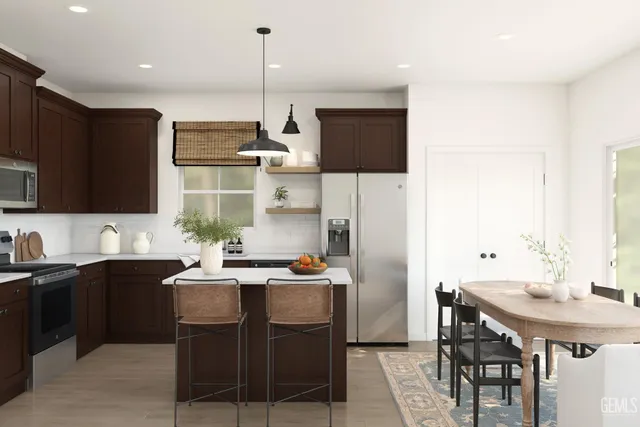 a kitchen with a table chairs sink and cabinets