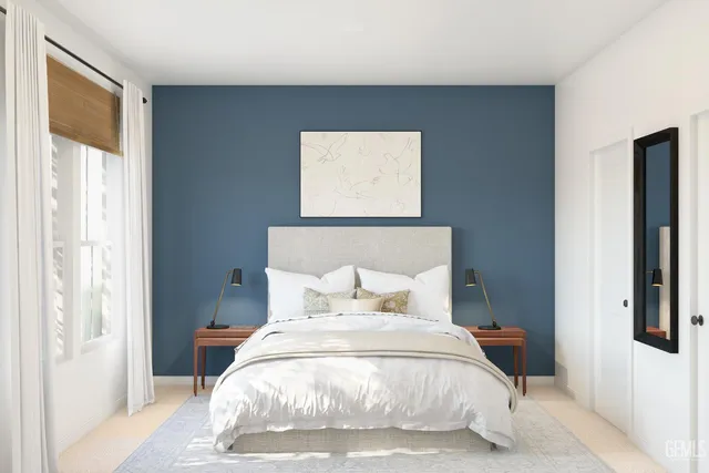 a bedroom with a bed and a window