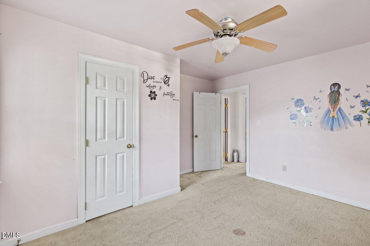3812 Providence Road Rocky Mount, NC 27803 - Photo 13 of 18 an empty room with windows and fan