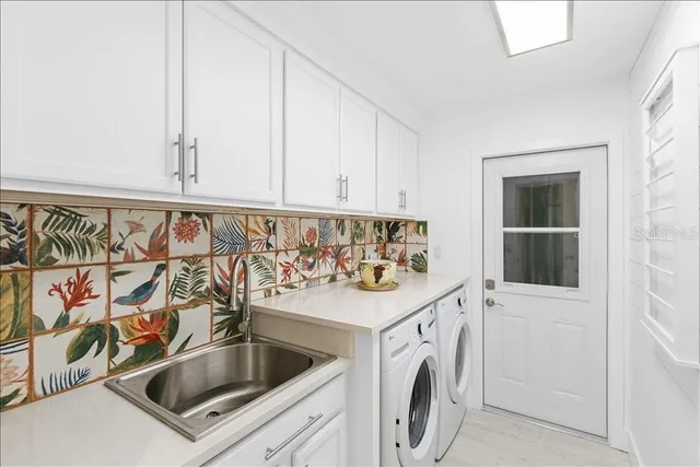 a utility room with dryer and washer
