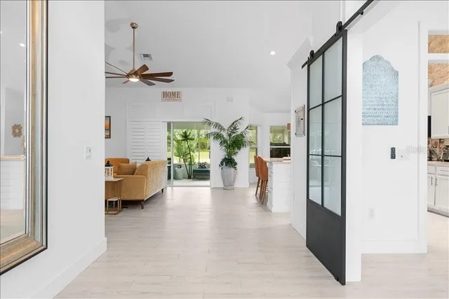 a view of a living room and a balcony