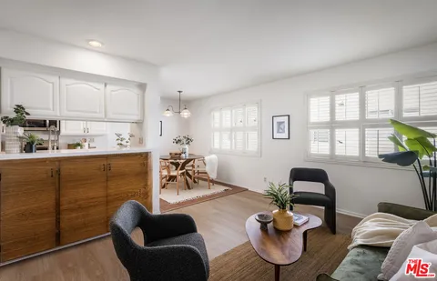a kitchen with a table and chairs