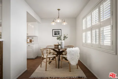 a kitchen with stainless steel appliances a sink a stove top oven a counter space and cabinets