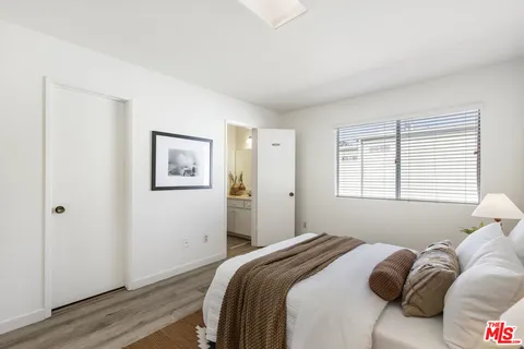 a bathroom with a toilet sink and shower curtain