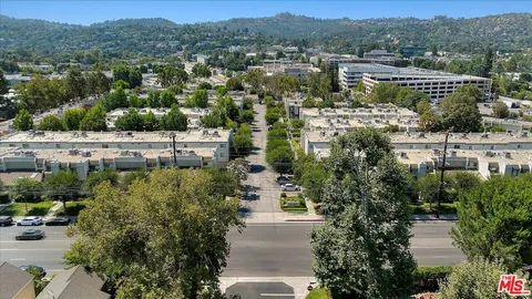 a small pool with outdoor seating and yard