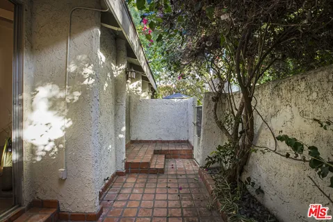 a backyard of a house with seating space