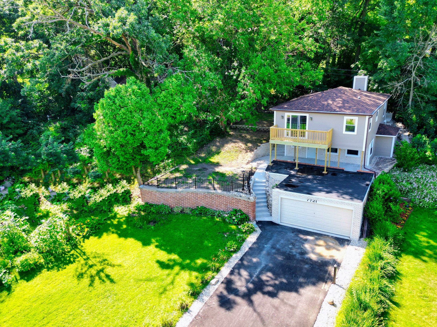 7721 Deep Spring Road Wonder Lake, IL 60097 - Photo 1 of 41 a front view of a house with a yard