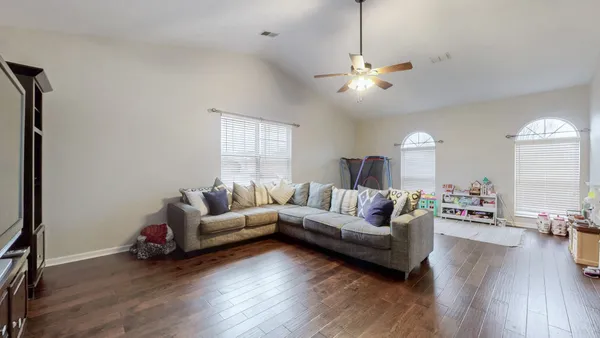 a bedroom with furniture and a chandelier