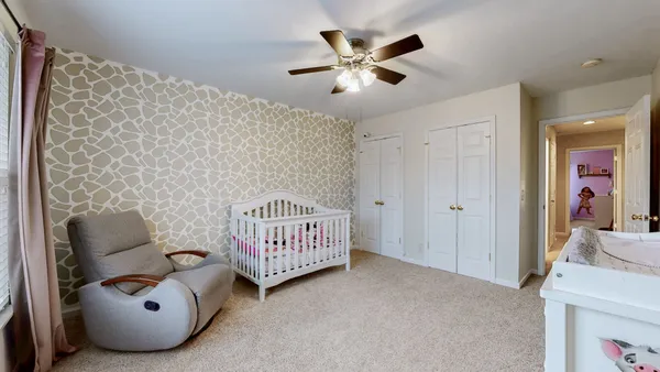 a bed room with furniture and a window