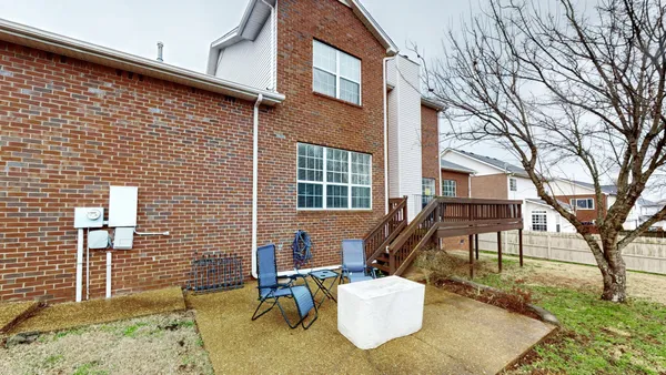 a view of a building with a yard