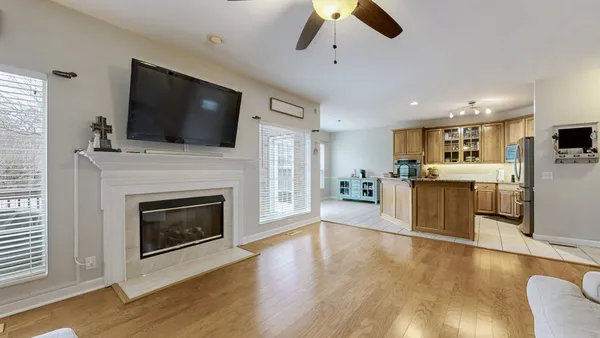 a kitchen with granite countertop a sink stove and cabinets