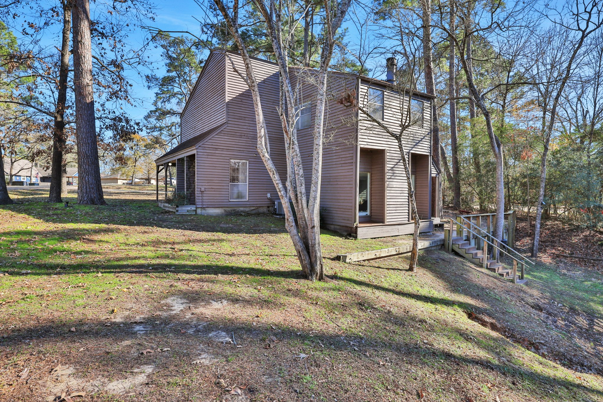 10 Drift Wood Lane Coldspring, TX 77331 - Photo 19 of 34 a view of a house with backyard and trees
