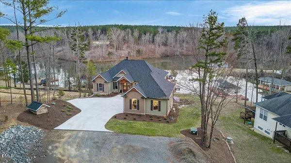 an aerial view of a house with a yard