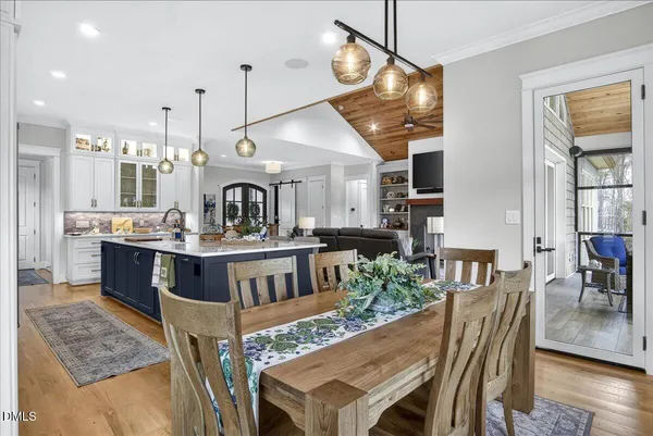 a bathroom with a granite countertop sink a mirror and a shower