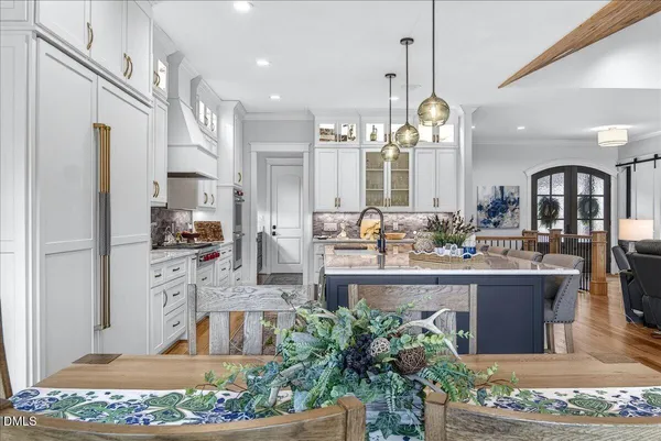 a bedroom with a large bed and a couch