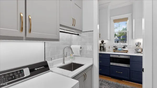 a bathroom with a double vanity sink toilet and shower
