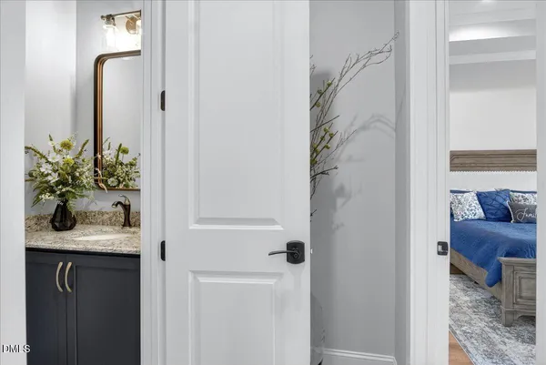 a view of a roof deck with table and chairs a barbeque with wooden floor and fence