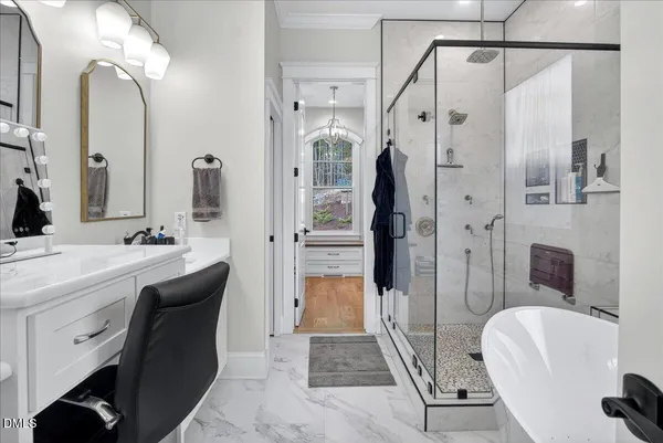 a bedroom with a large bed and a large window