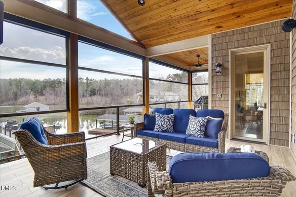 a bathroom with a granite countertop sink toilet a mirror and shower