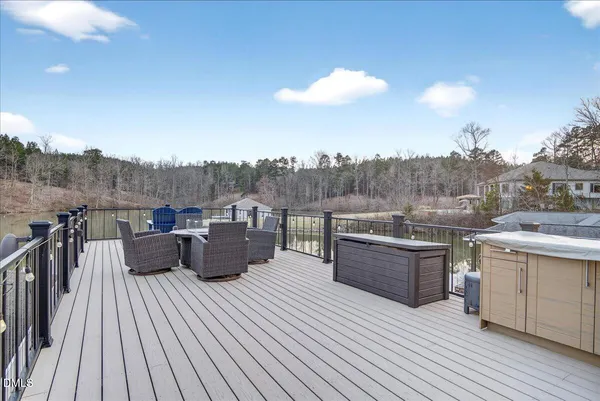 a large bedroom with a bed and a flat screen tv