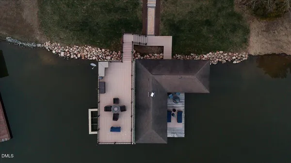a view of a patio with a table chairs and backyard