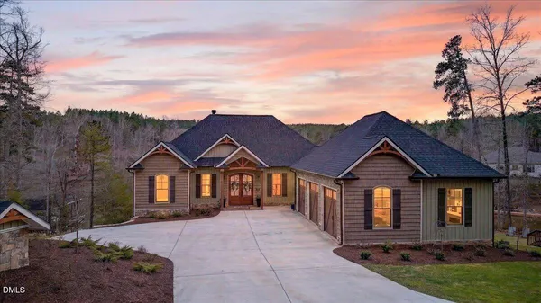 a view of a porch with wooden floor and windows
