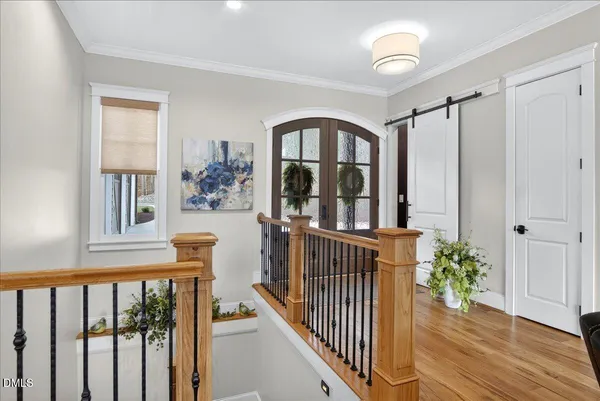 a kitchen with stainless steel appliances kitchen island granite countertop a table chairs sink and cabinets