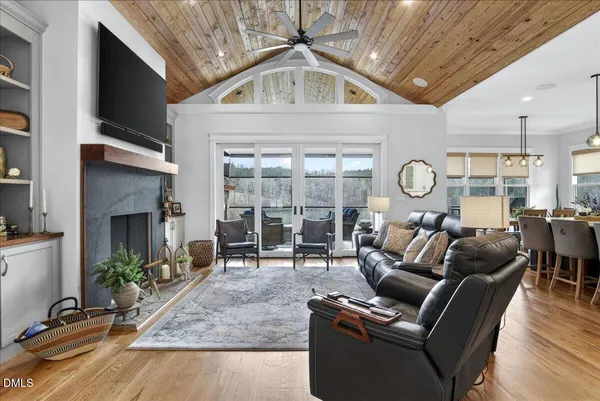 a large kitchen with stainless steel appliances kitchen island granite countertop a sink and cabinets