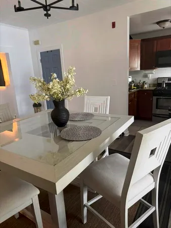 a kitchen with a table and chairs