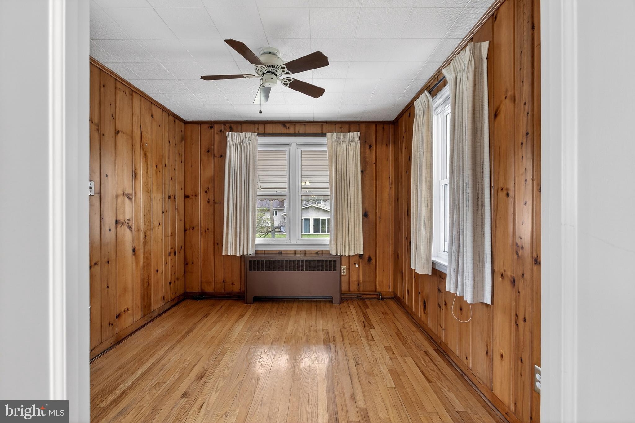 821 Kenyon Lane Newark, DE 19711 - Photo 21 of 50 a view of workspace with wooden floor and fan