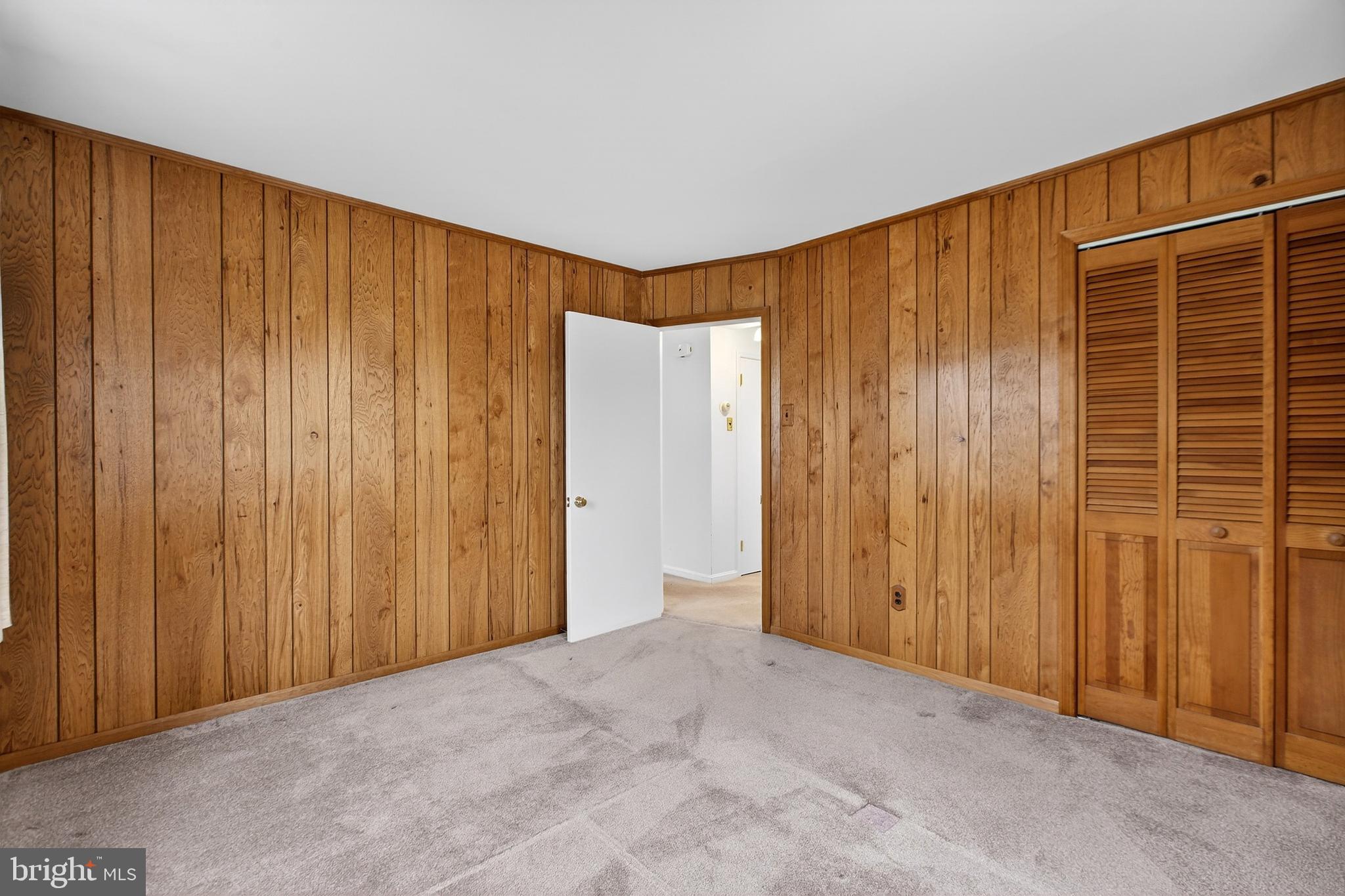821 Kenyon Lane Newark, DE 19711 - Photo 24 of 50 a view of an empty room with wooden walls