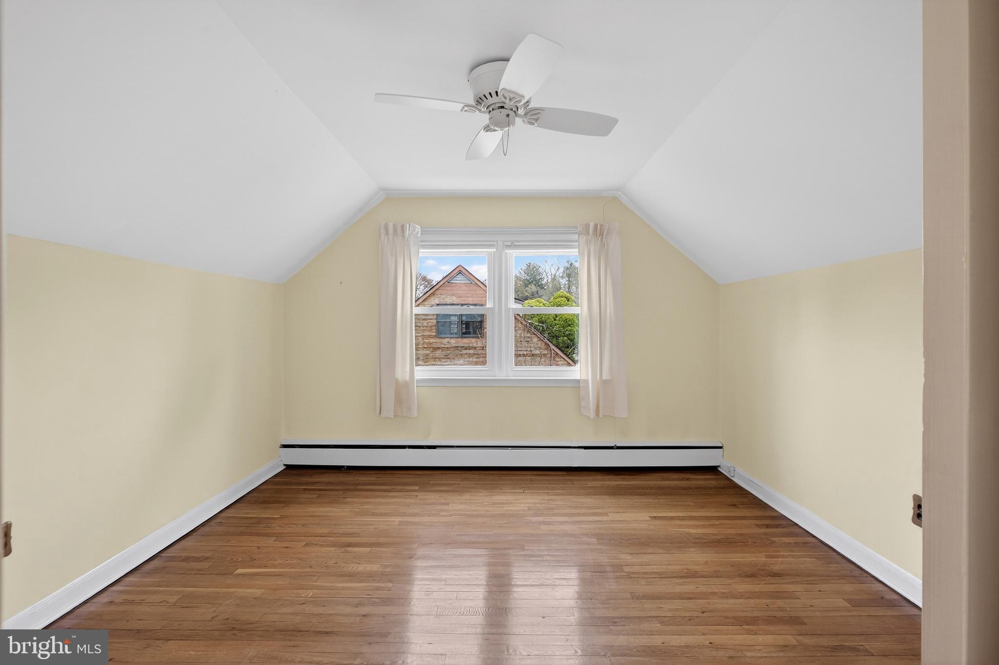 821 Kenyon Lane Newark, DE 19711 - Photo 31 of 50 an empty room with a window and a ceiling fan