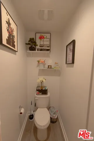 a bathroom with a toilet and a sink