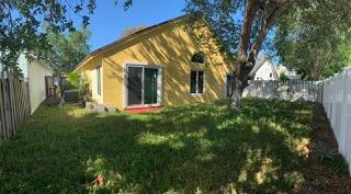 1321 East Glen Oak Road North Lauderdale, FL 33068 - Photo 2 of 7 a backyard of a house with lots of green space