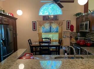 1321 East Glen Oak Road North Lauderdale, FL 33068 - Photo 4 of 7 a dining room with furniture and window