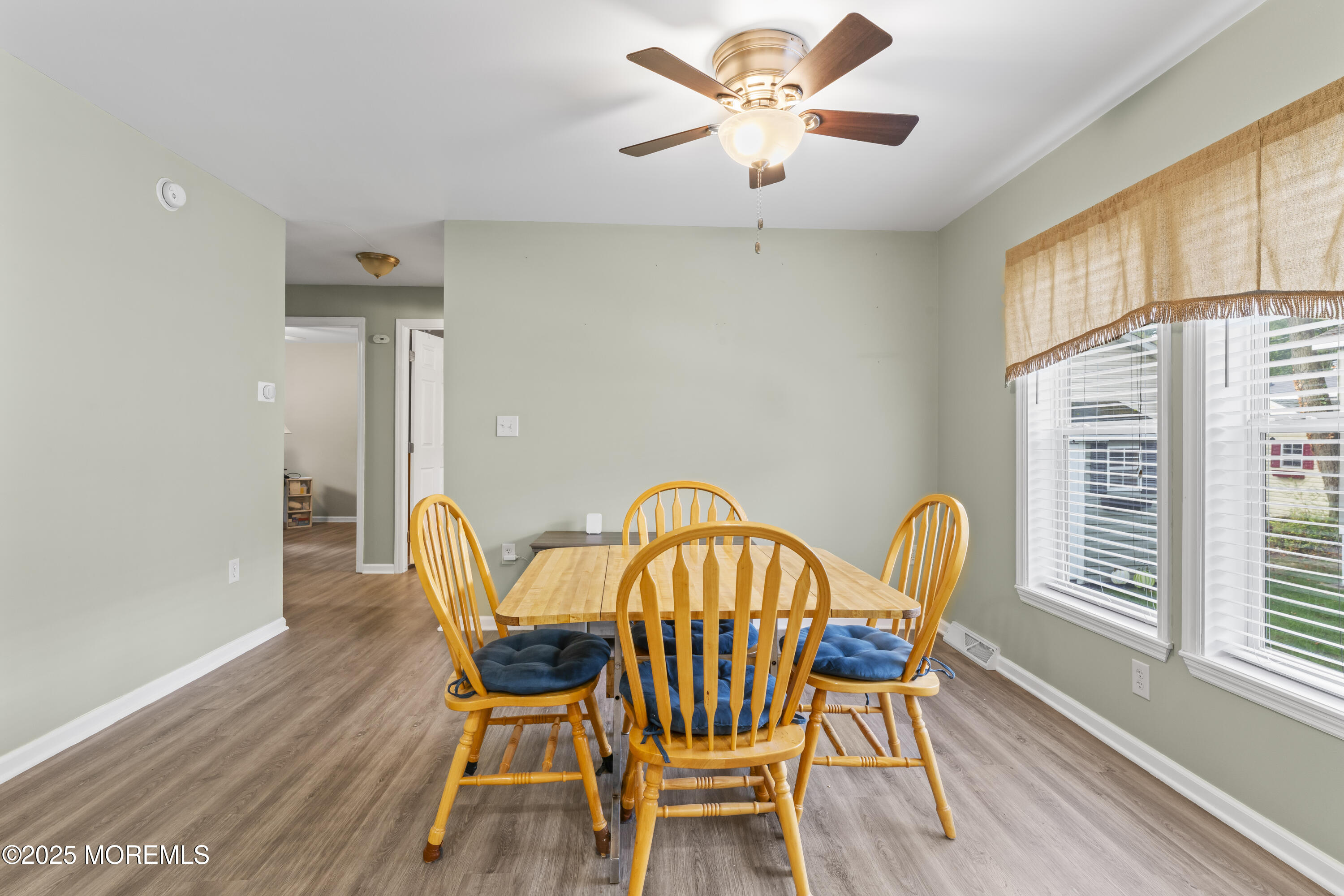 75 Village Road Morganville, NJ 07751 - Photo 11 of 27 a view of a dining room with furniture window and wooden floor