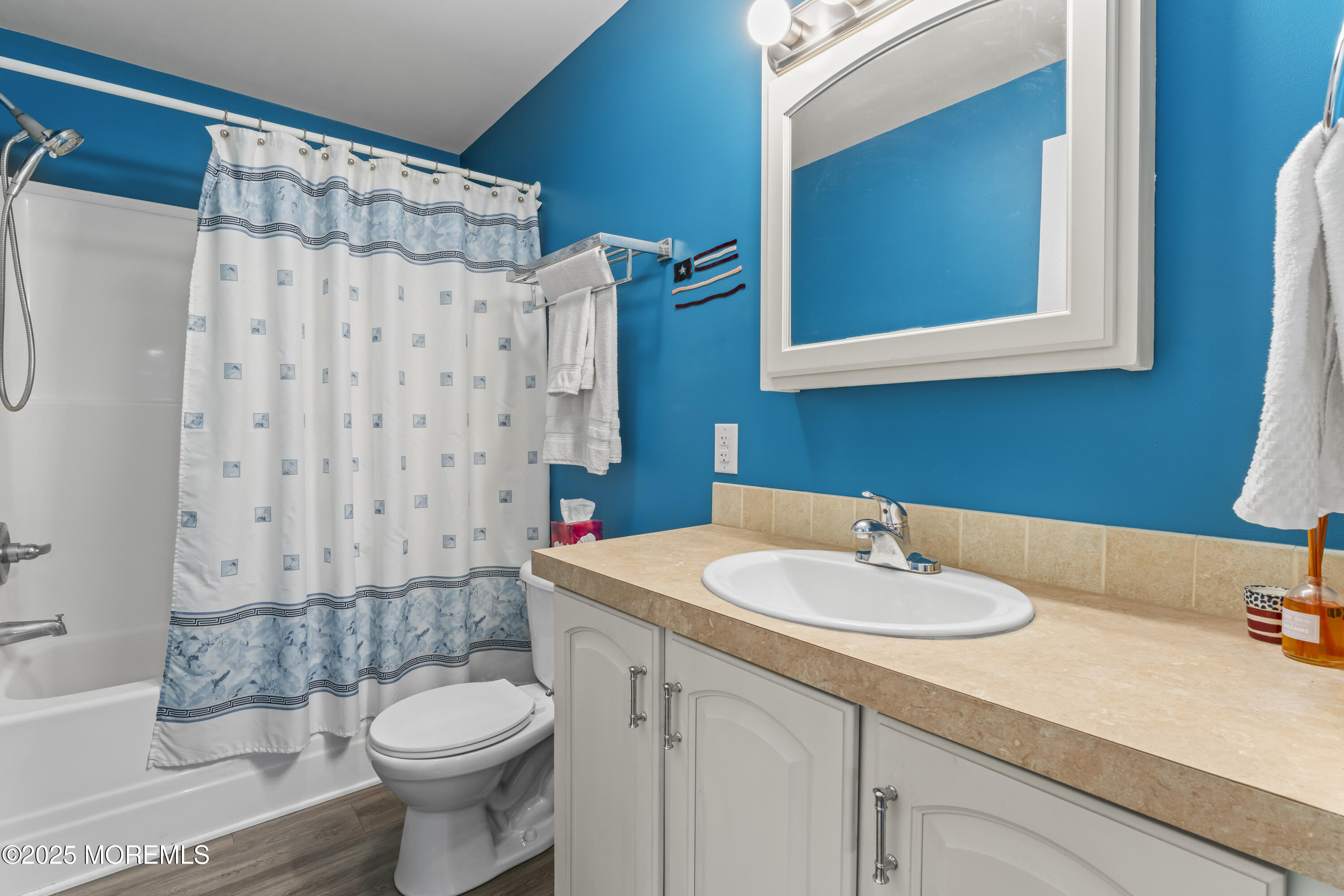 75 Village Road Morganville, NJ 07751 - Photo 13 of 27 a bathroom with a sink toilet and shower
