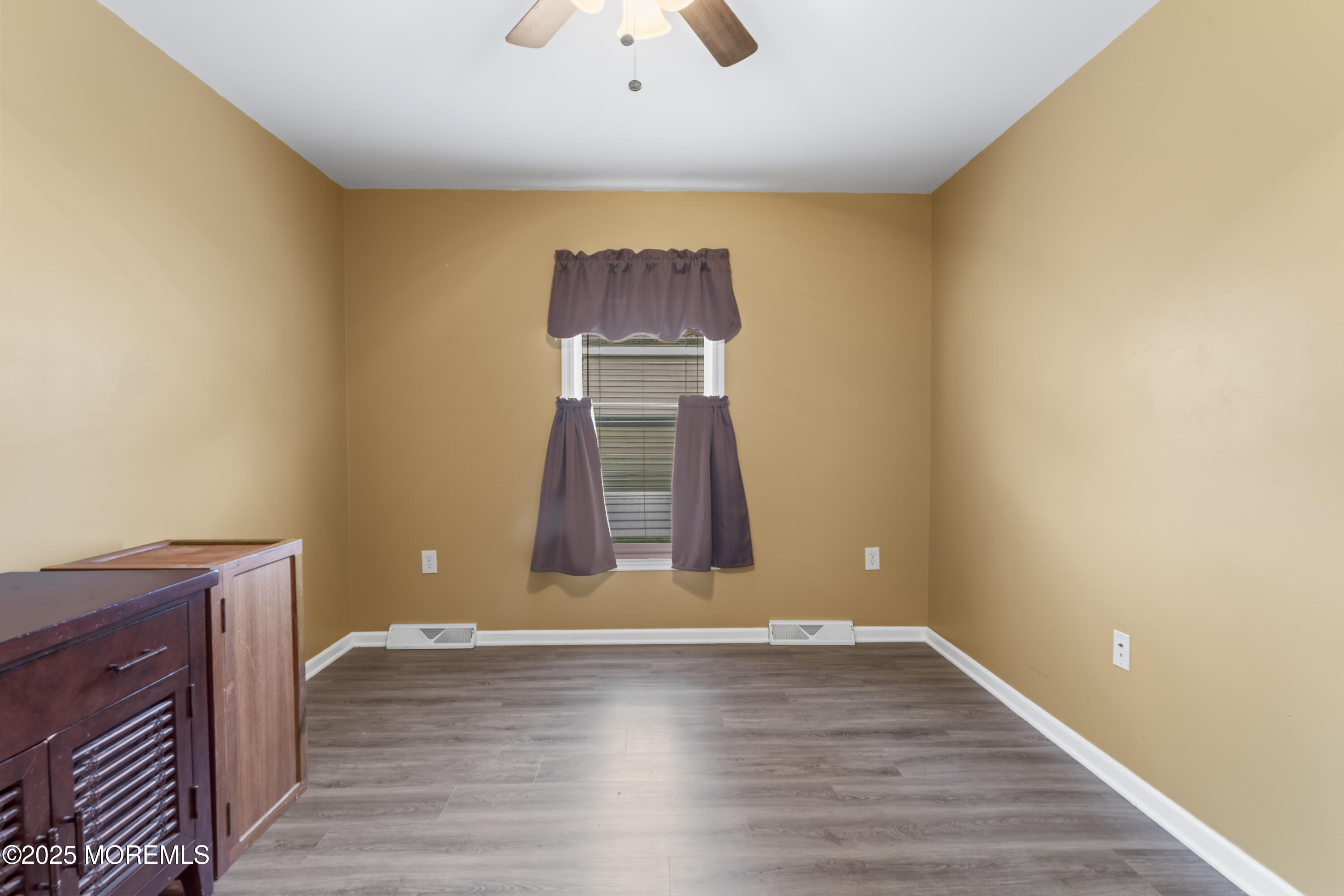 75 Village Road Morganville, NJ 07751 - Photo 14 of 27 a view of a hallway with wooden floor