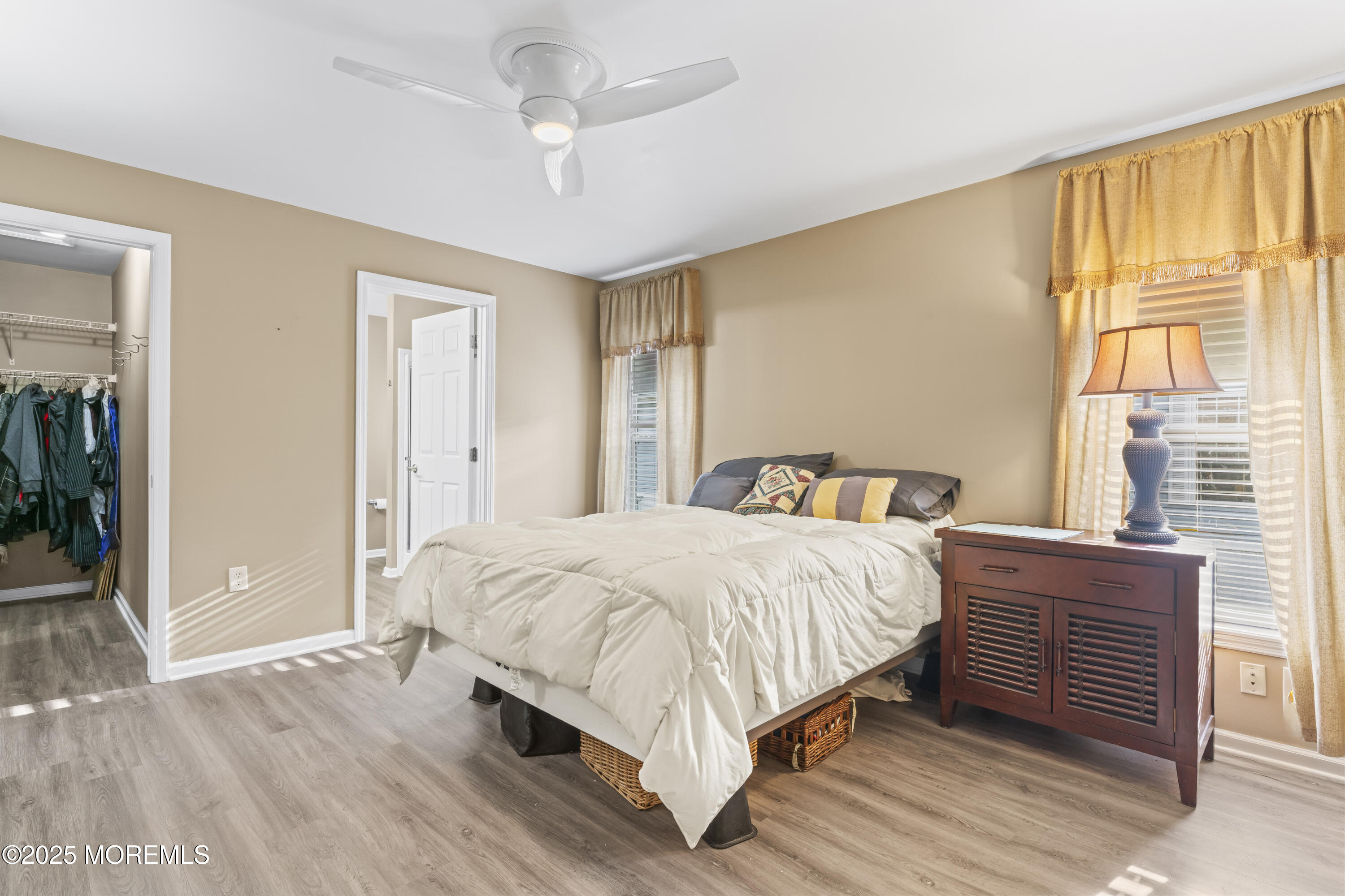 75 Village Road Morganville, NJ 07751 - Photo 18 of 27 a bedroom with a bed wooden floor and window