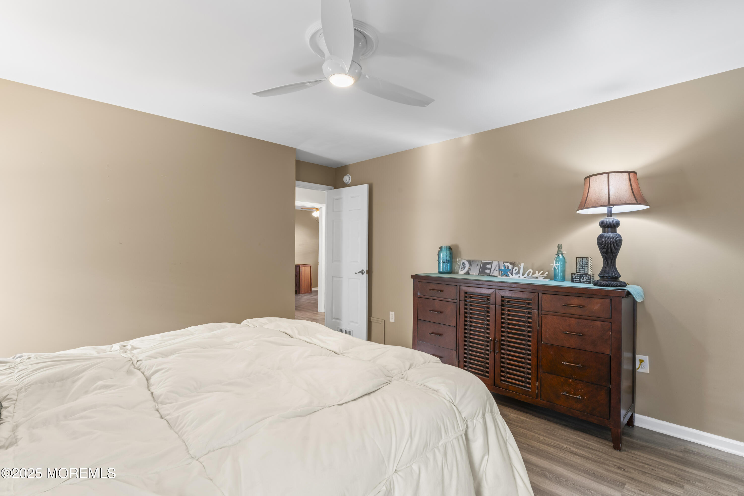 75 Village Road Morganville, NJ 07751 - Photo 20 of 27 a bedroom with a bed and a dresser