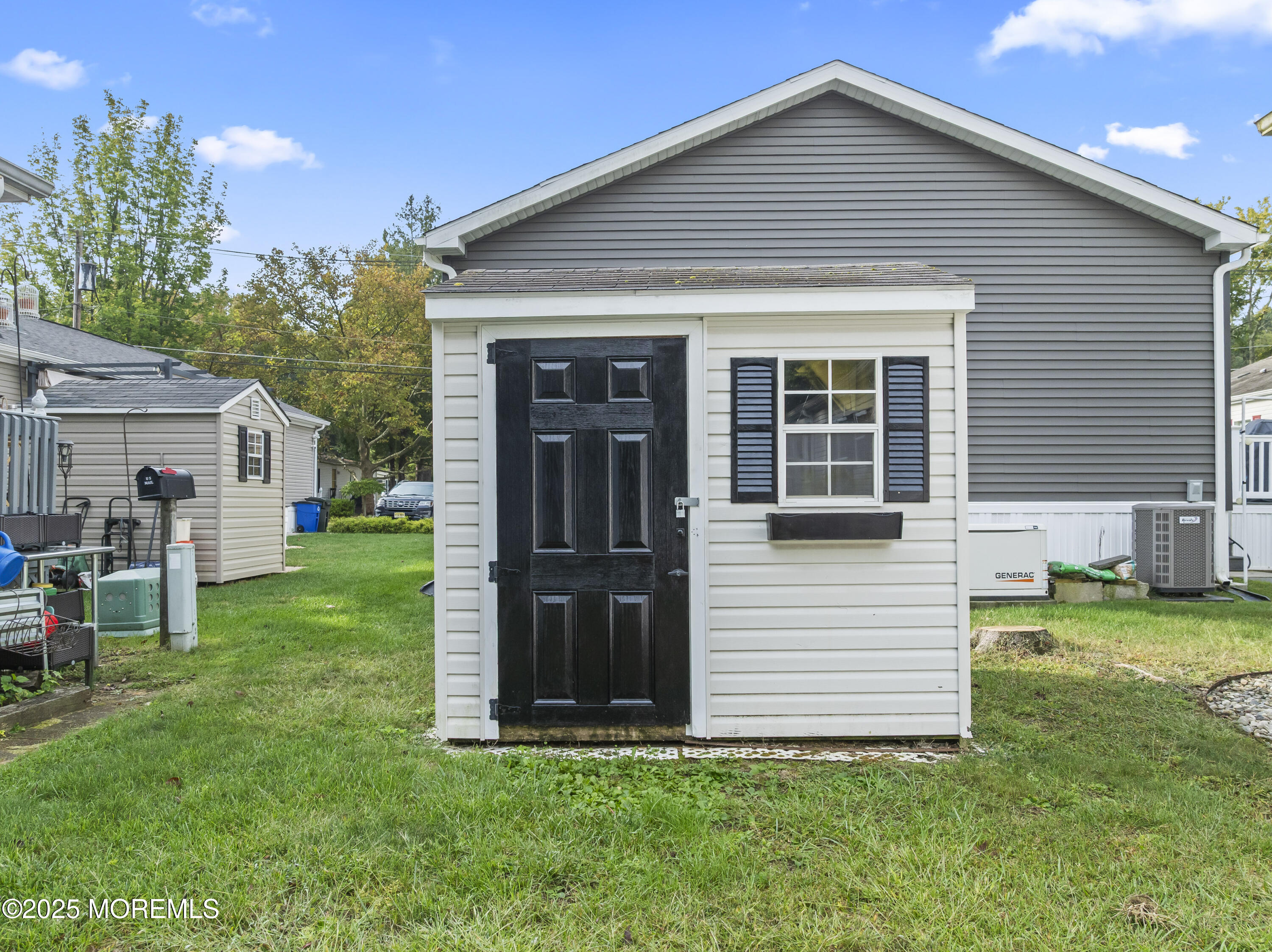 75 Village Road Morganville, NJ 07751 - Photo 24 of 27 a view of a house with a yard
