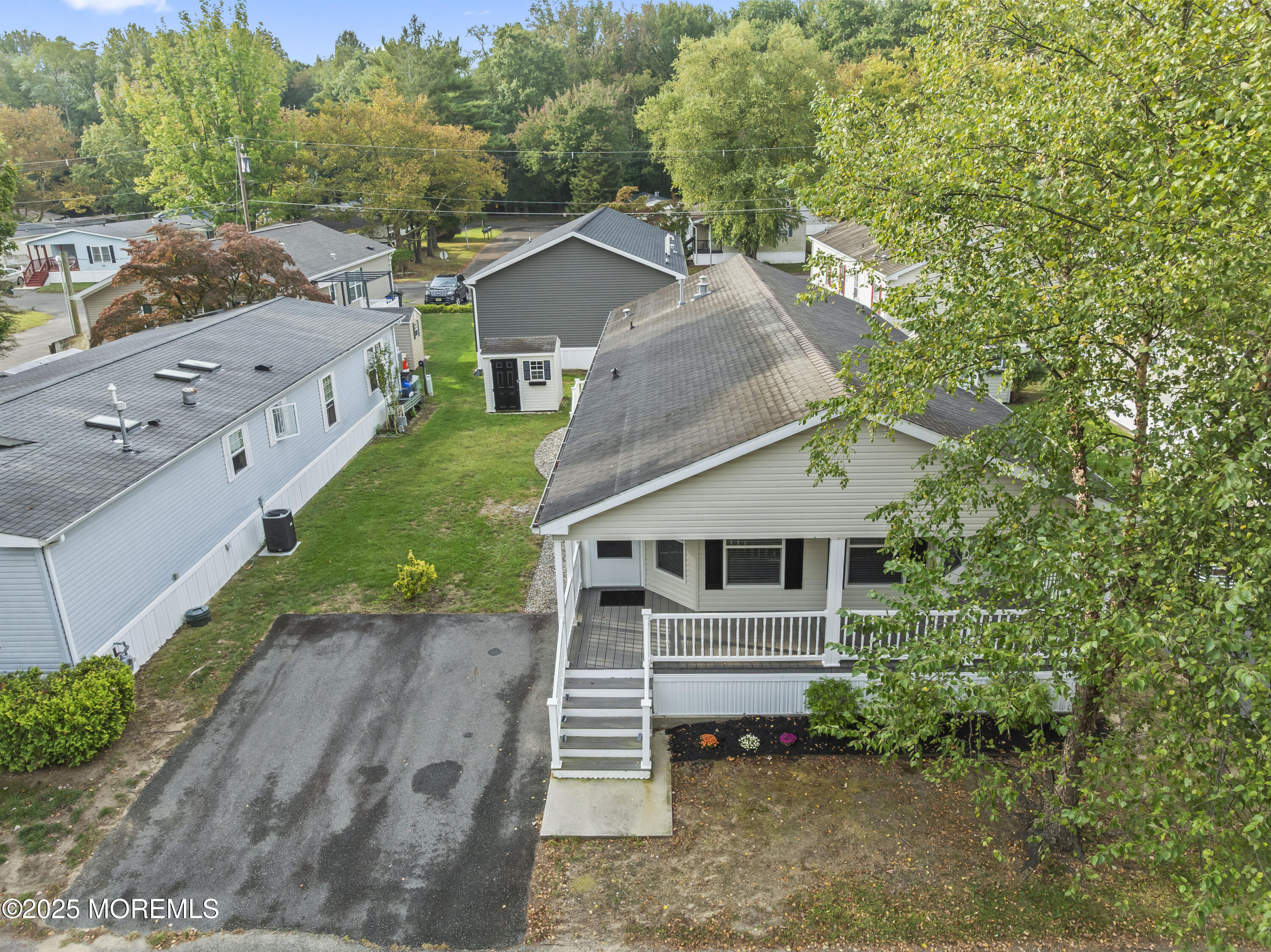 75 Village Road Morganville, NJ 07751 - Photo 25 of 27 a front view of a house with a yard