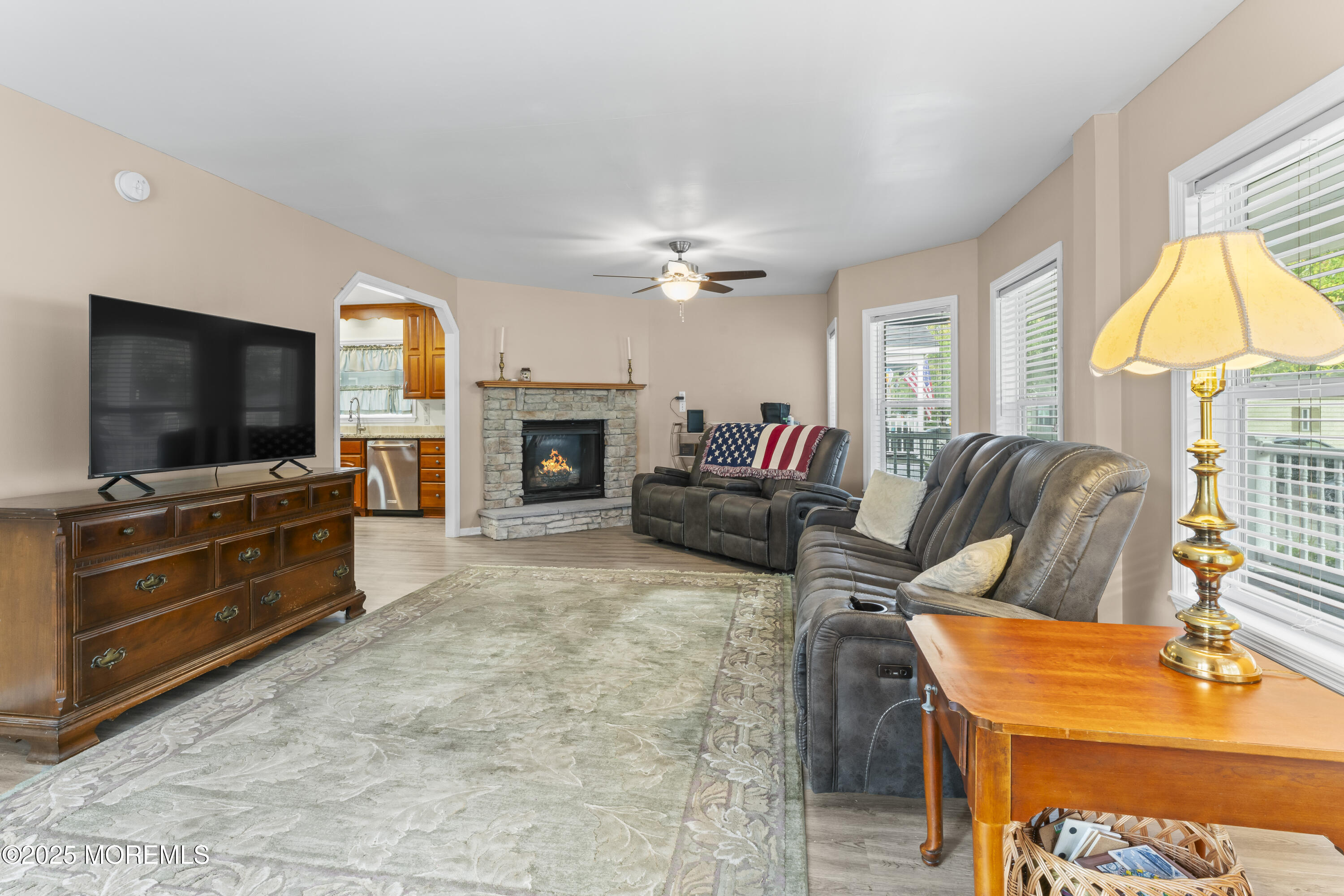 75 Village Road Morganville, NJ 07751 - Photo 4 of 27 a living room with furniture and a flat screen tv