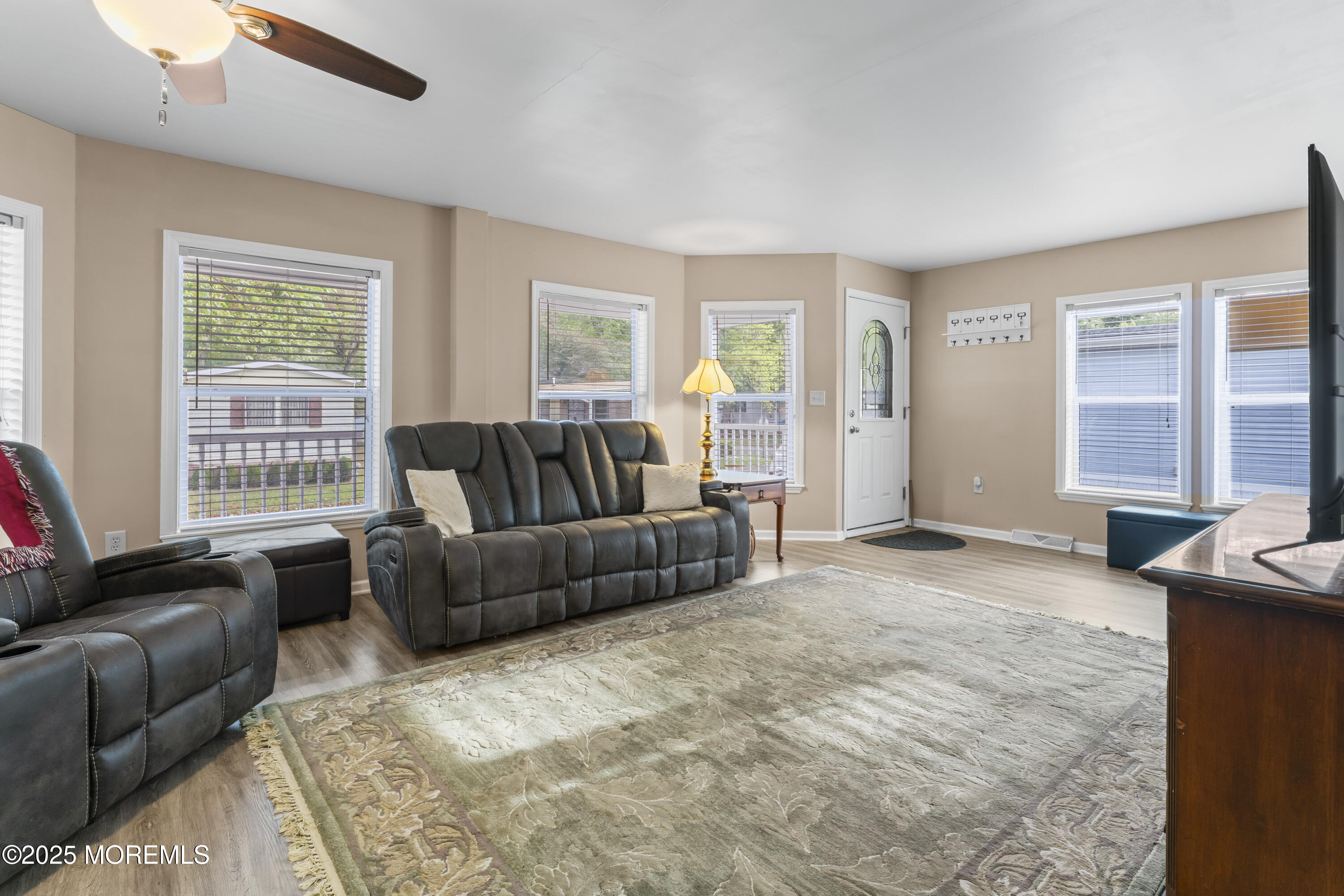 75 Village Road Morganville, NJ 07751 - Photo 5 of 27 a living room with furniture and windows