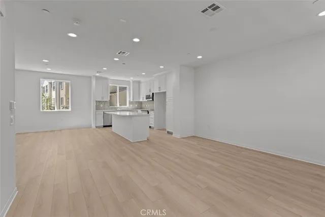 a view of a kitchen with a sink and a window