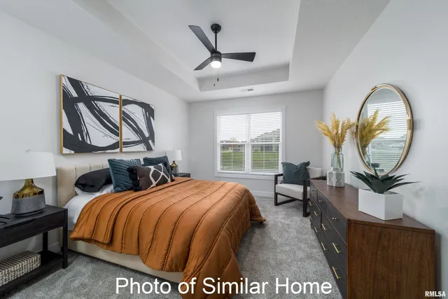 a bed room with a bed and a chair