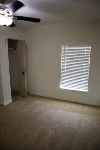 an empty room with closet area