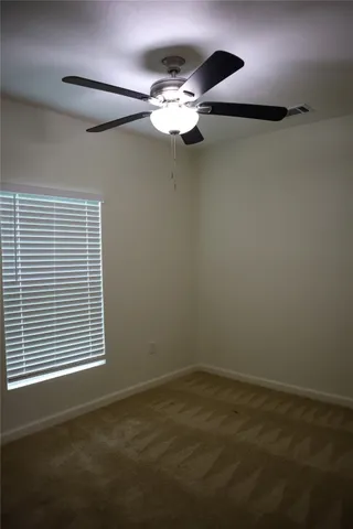 a bath room with a toilet and a bath tub